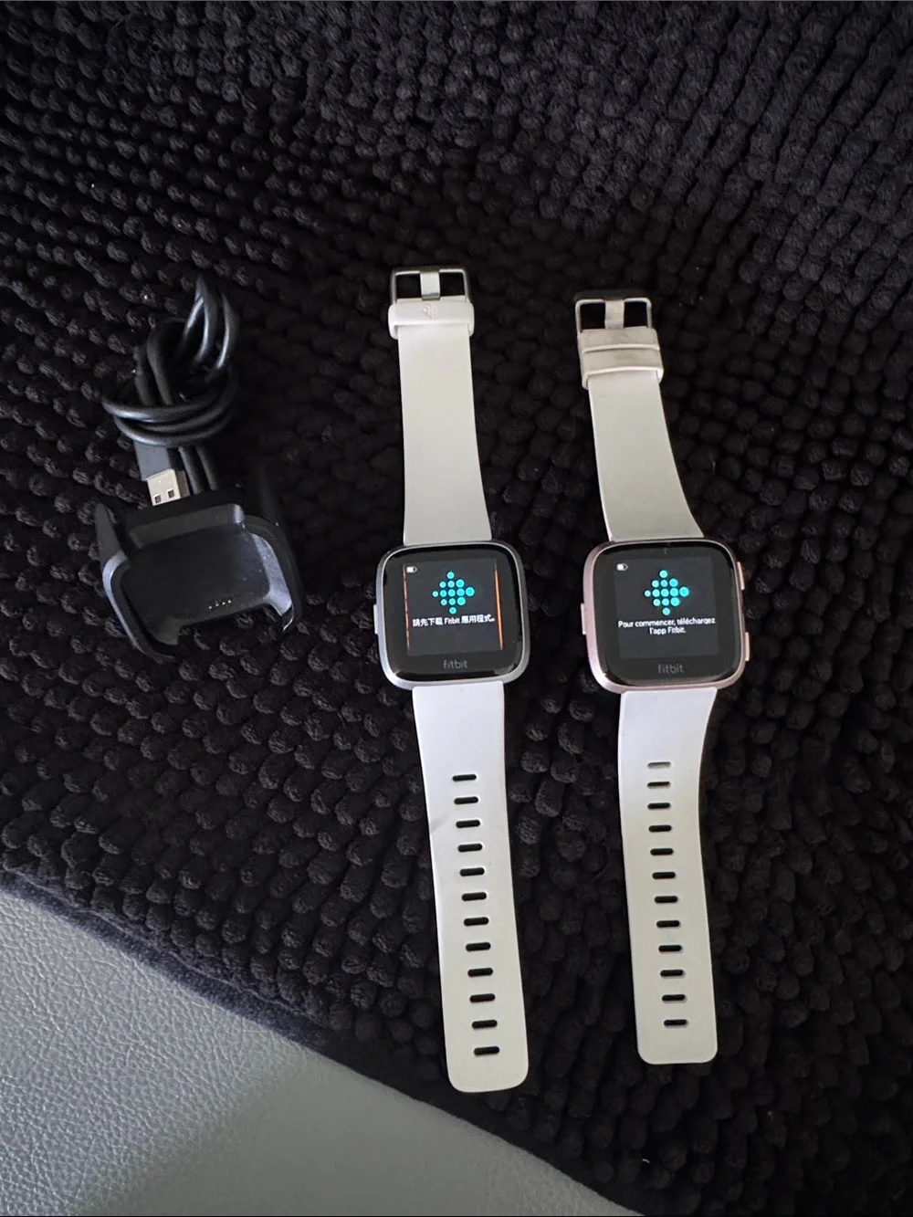 fitbit Versa and Lite Smartwatches with White Bands and Charger